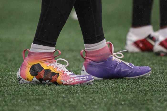 Atlanta Falcons linebacker Andre Smith's purple and pink Nike cleats.